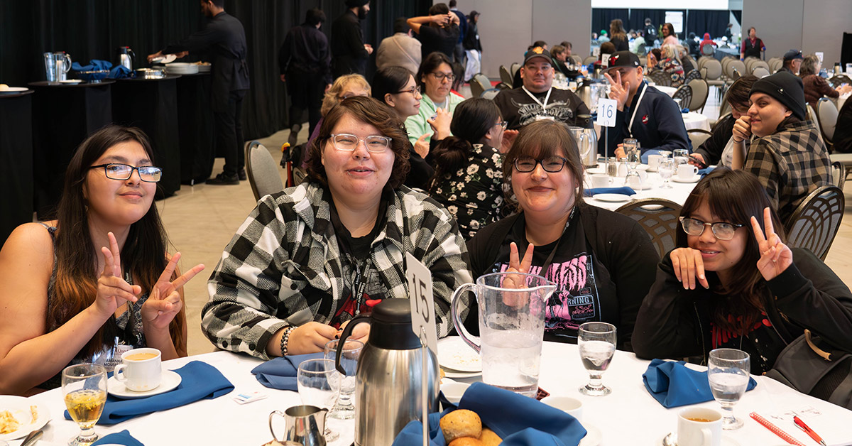 Youth at tables greeting